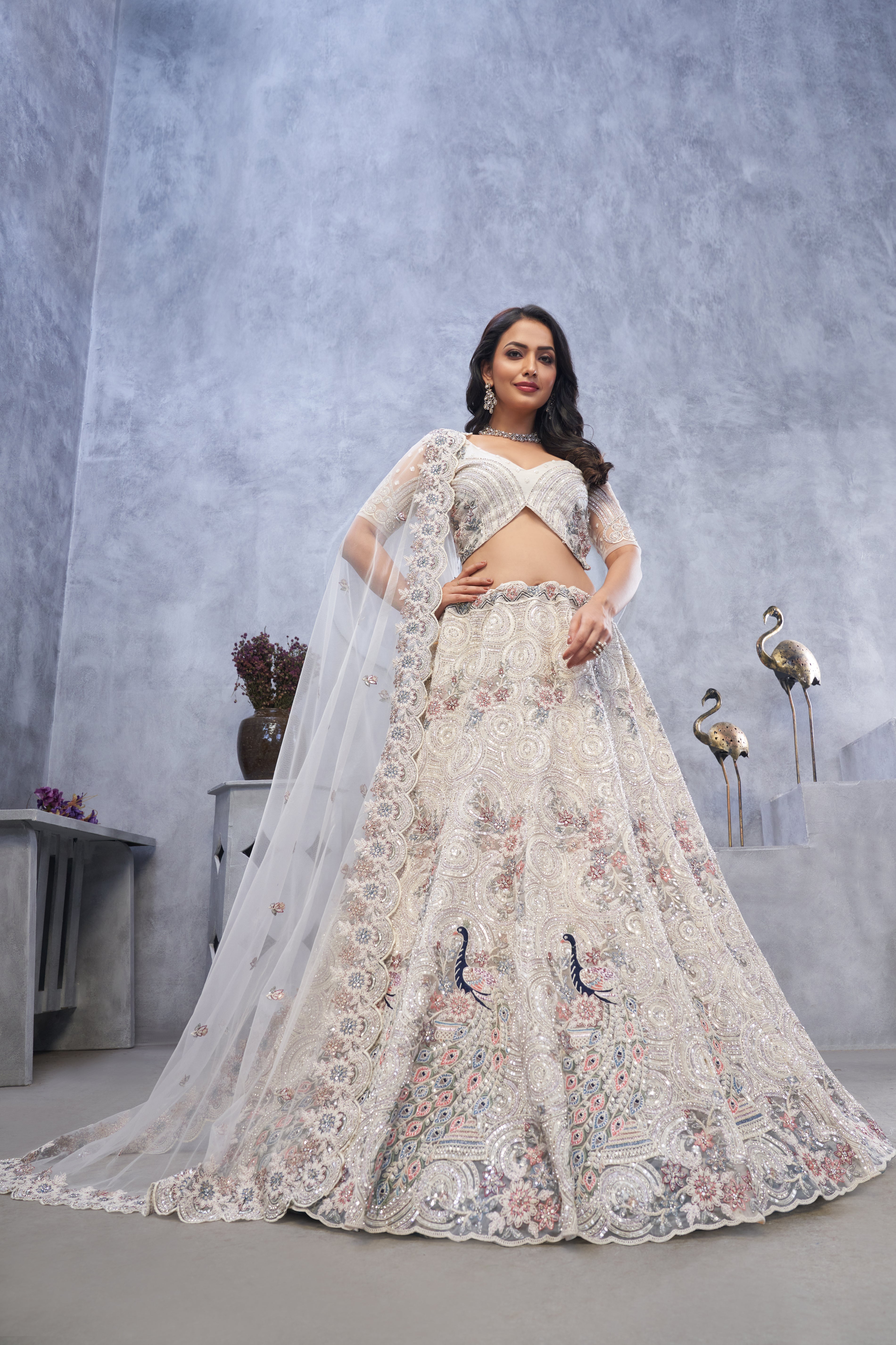 Premium Ivory Peacock & Bagh Embroidered Net Lehenga Set
