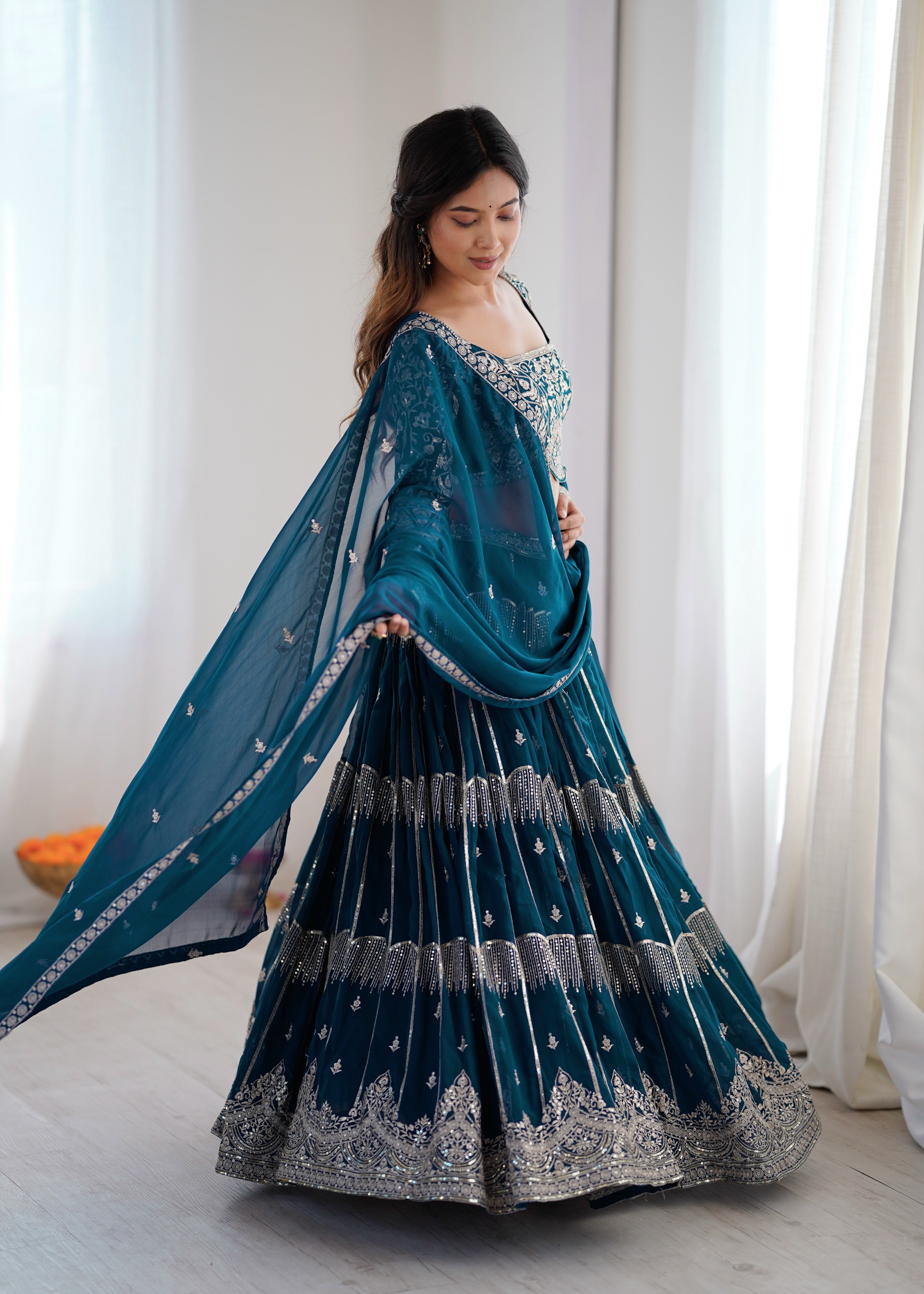 
Designer Teal Blue Faux Georgette Flaired Lehenga Choli Set With Dupatta
