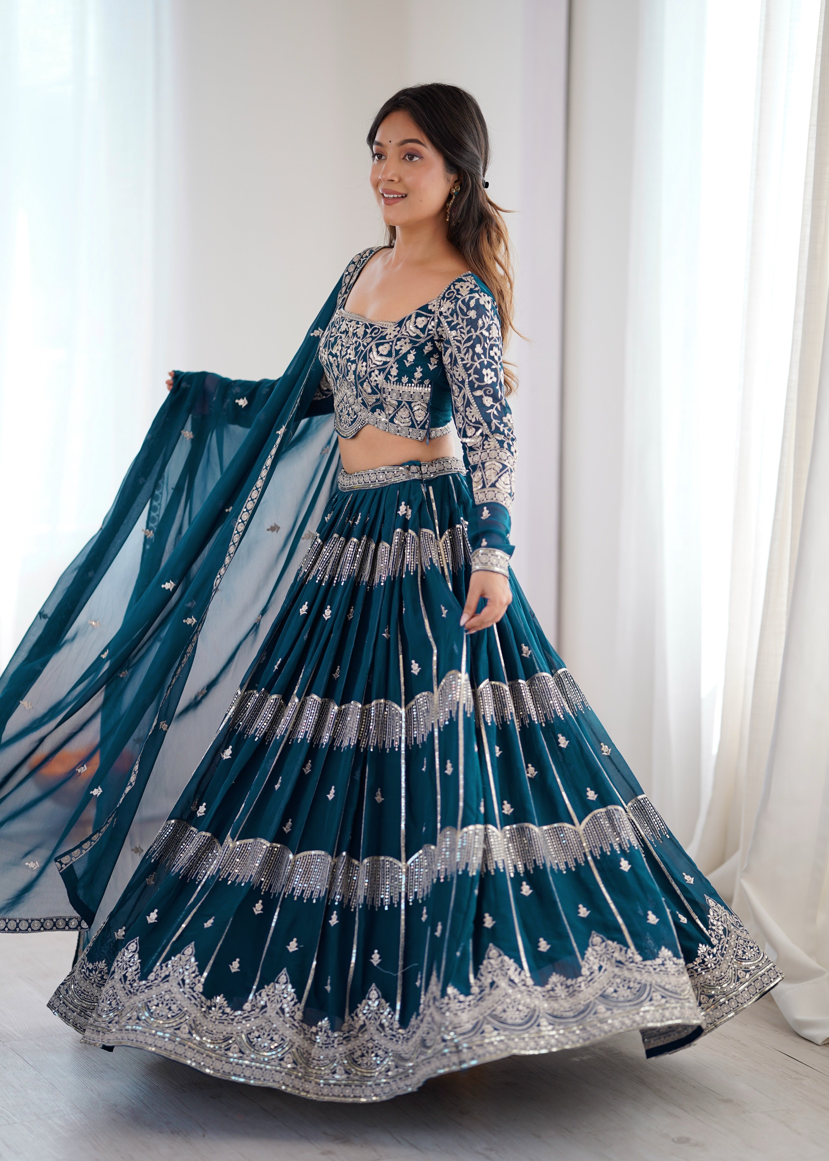 
Designer Teal Blue Faux Georgette Flaired Lehenga Choli Set With Dupatta
