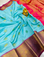 Adorning Firozi Organza Silk Saree With Delightful Blouse Piece