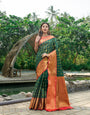 Invaluable Dark Green Kanjivaram Silk Saree and Fugacious Blouse Piece